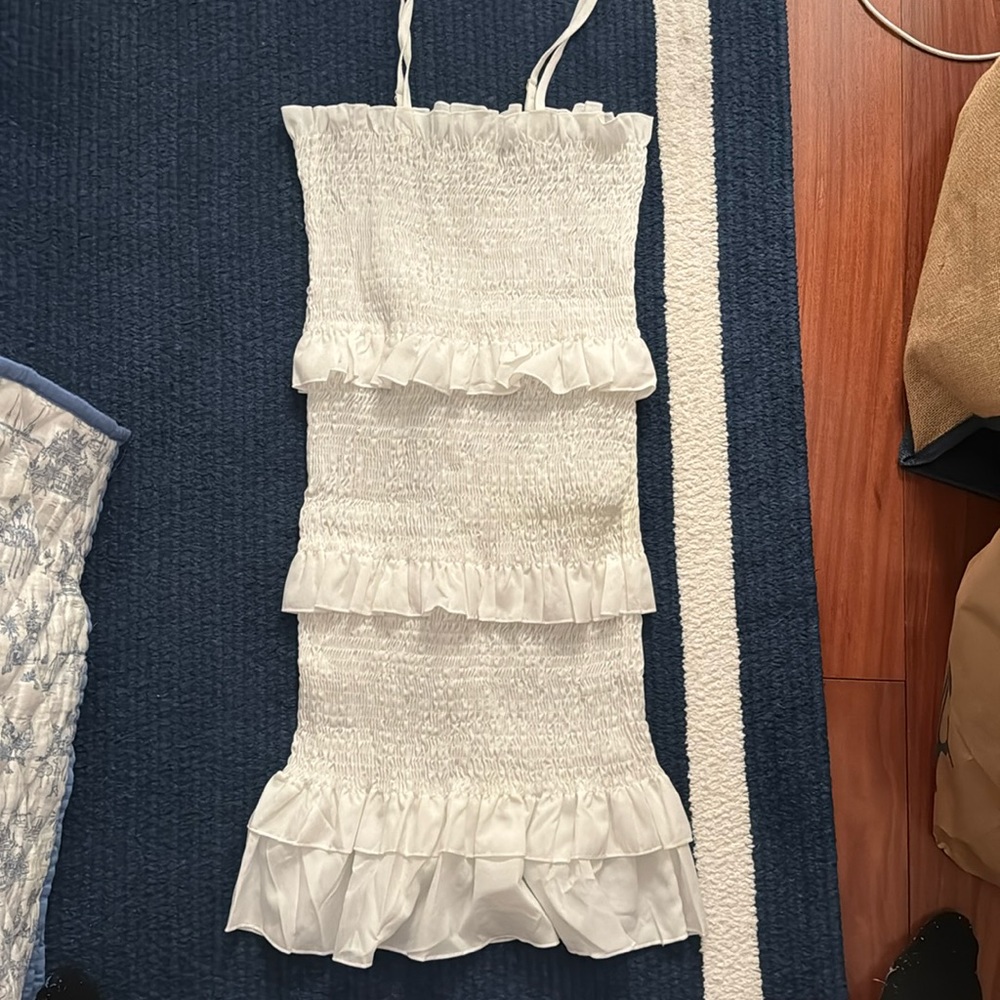 white smocked mini dress with ruffles